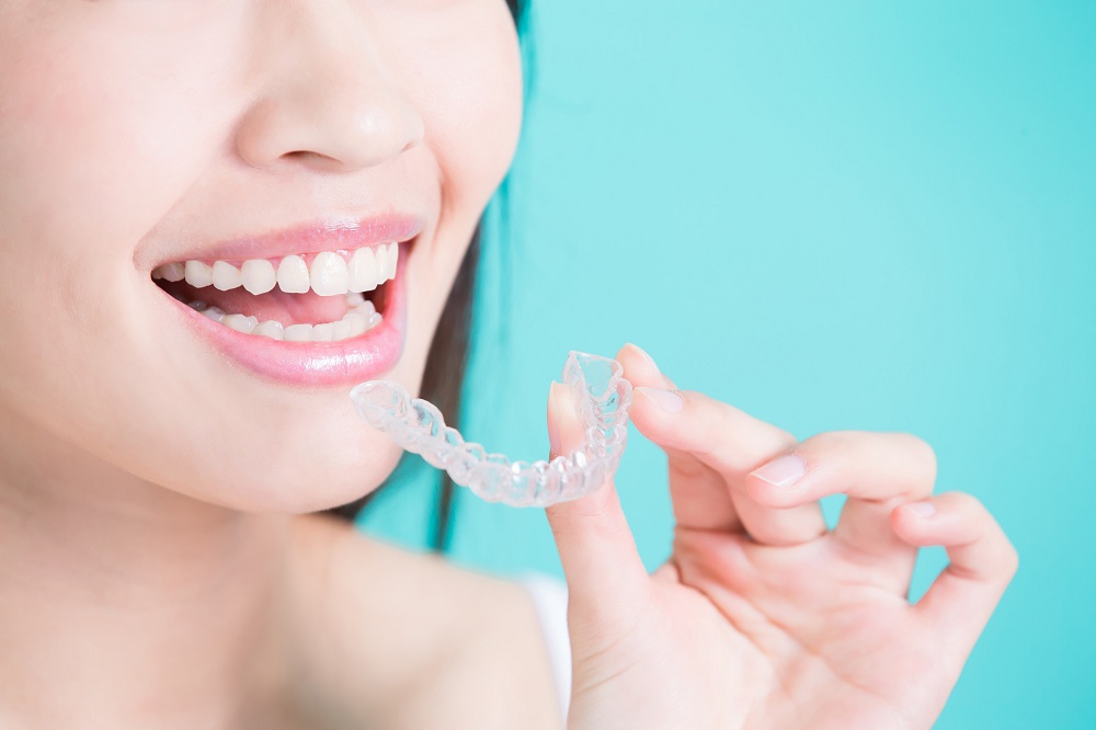 woman wearing Invisalign